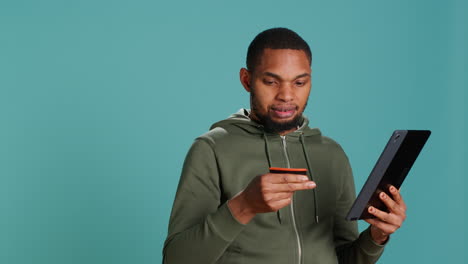 man adding payment method on website using laptop