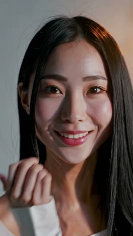 close-up portrait of a smiling asian woman