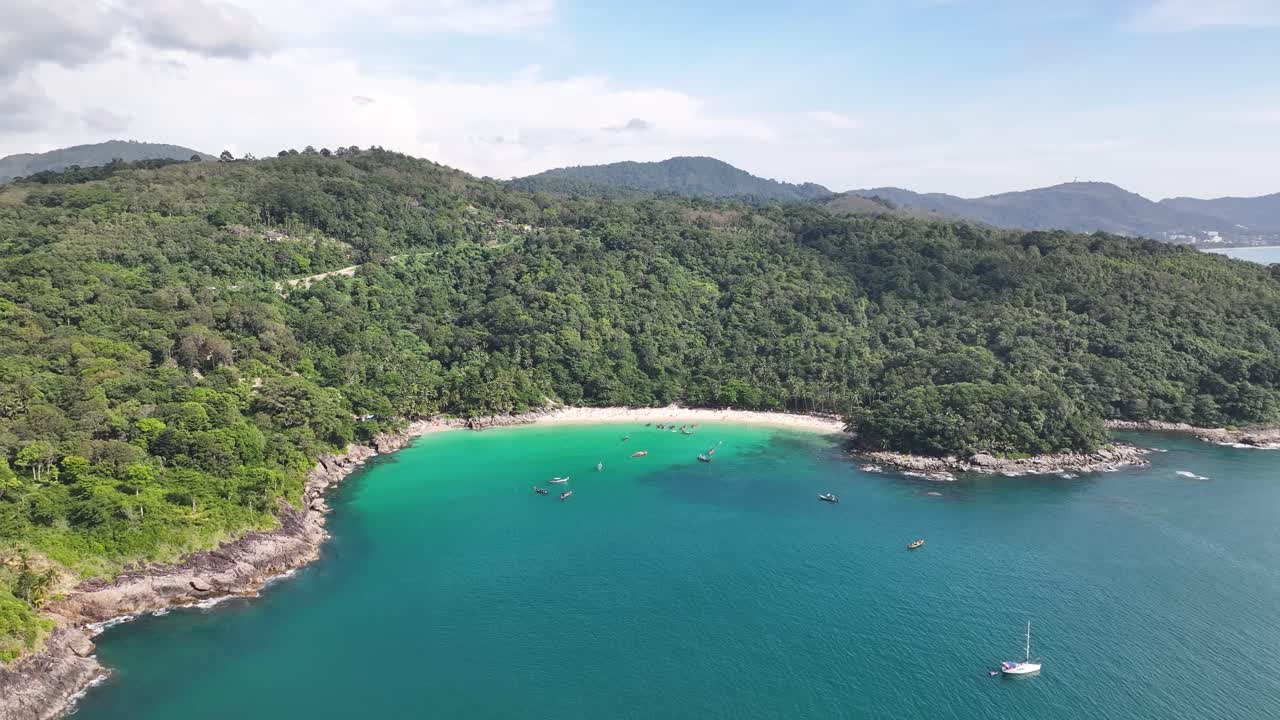 Freedom Beach, Phuket, Thailand. Wide aerial of small cove with beautiful beach and lush forest.