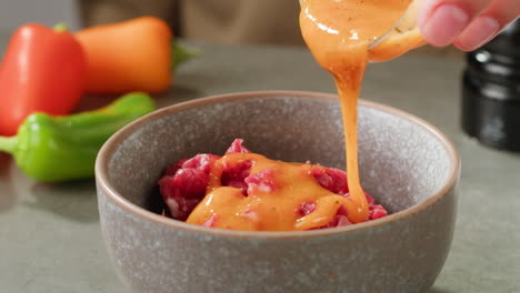 marinating raw beef with orange sauce