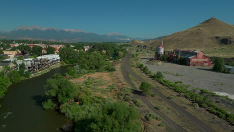 Salida-Colorado-aerial-cinematic-drone-mid-summer-downtown-S-Lime-Mill-near-Buena-Vista-on-Arkansas-River-Riverside-Park-Scout-surfing-wave-biking-hiking-rafting-Rocky-Mountain-forward-slow-movement