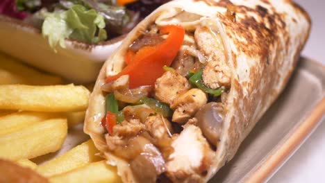 chicken wrap with fries and salad