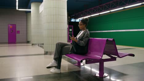 woman sitting in a subway station