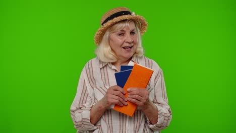 traveler tourist senior woman holding passport tickets dreams of which country go rest on vacation