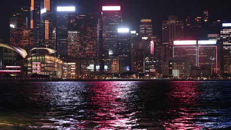 vibrant city lights reflecting on water surface