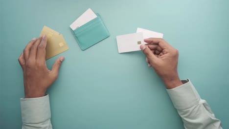 person holding credit cards