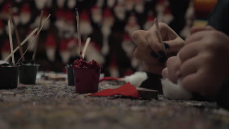 kid and woman doing santa claus craftwork