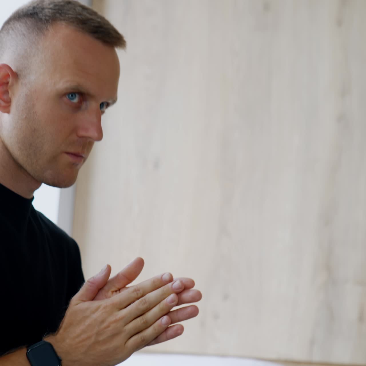 Concerned Caucasian man walking by the delivery room. Husband worries for his wife giving childbirth