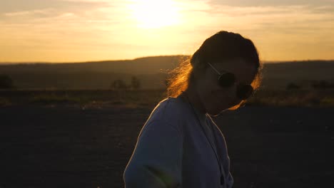 female girl positive energy, smile at sunrise early morning looking around