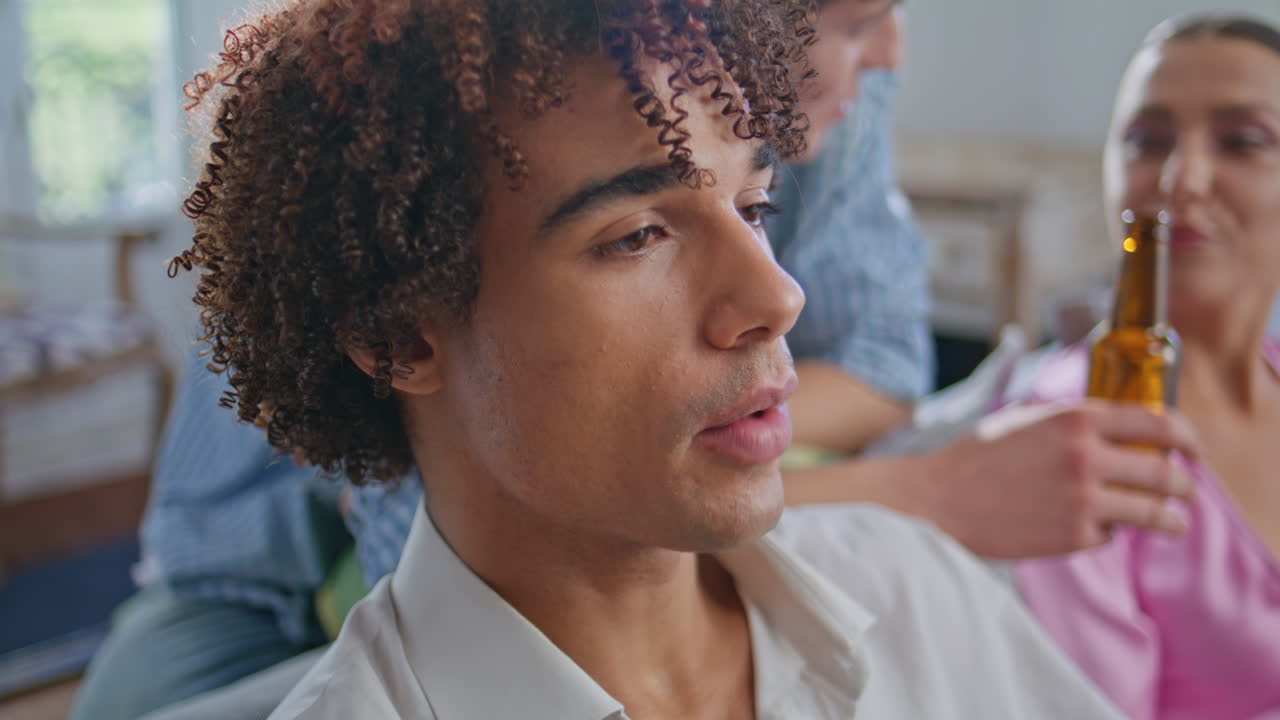 o teen chewing popcorn at movie party with classmates closeup. Happy mates