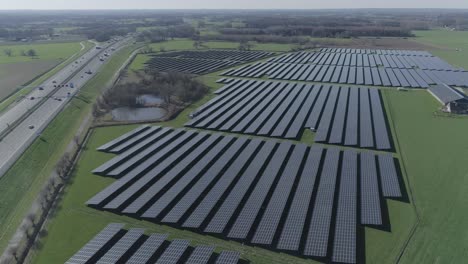 Aerial-drone-shot-of-a-field-with-solar-panels