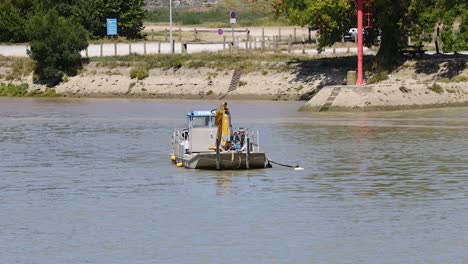 a boat moves along a river