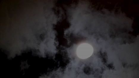 looking at young moon from sky over boat sailing on sea in summer night sky point of view shot