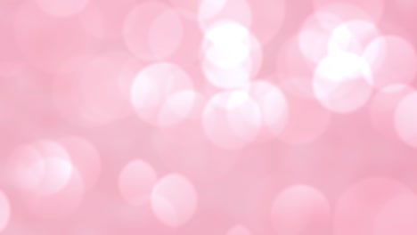 beautiful romantic pink bokeh blur abstract light particles background.