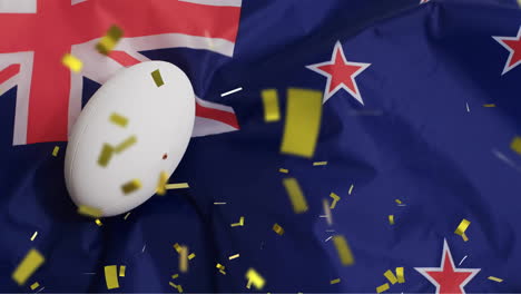 animation of confetti over white rugby ball and flag of new zealand