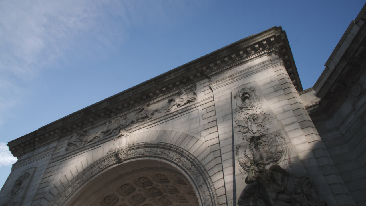 Traffic passing the Manhattan Bridge Arch and Colonnade. Shot on an autumn morning in New York City