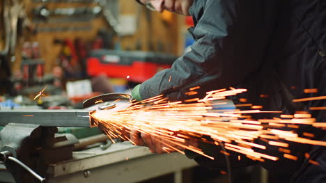 Angle-Grinder-Cutting-Metal-At-Workshop-18