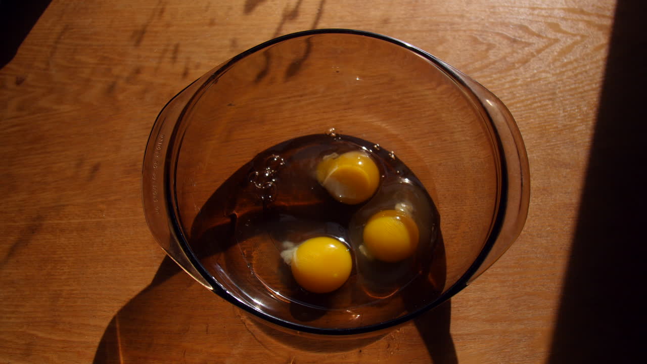 Cracking Eggs and Putting Them into a Bowl