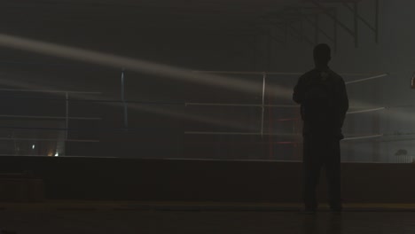 silhouette of a man in a boxing gym