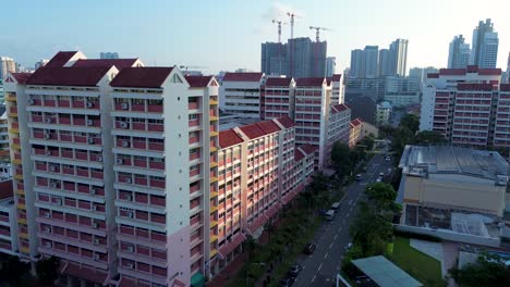 aerial drone landscape shot of cbd skyline with buildings tower apartment blocks units town on suburban street in singapore city farrer park asia