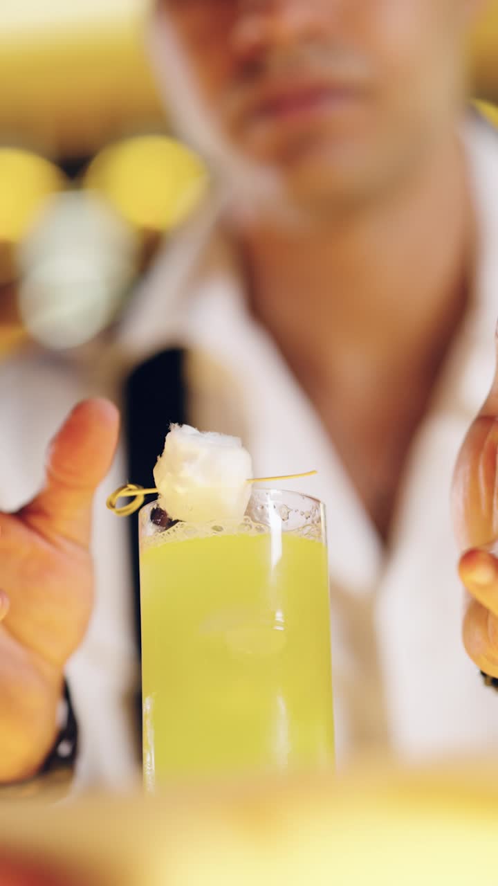 Professional Bartender Garnishing a Refreshing Green Cocktail