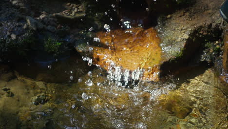 woman hands washing in crystal spring water. slow motion video human hands