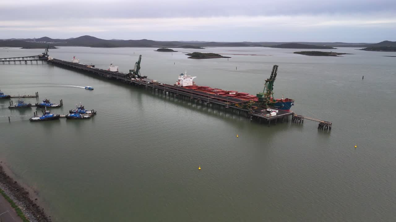 Aerial approaches coal shipping terminal at Gladstone QLD Australia