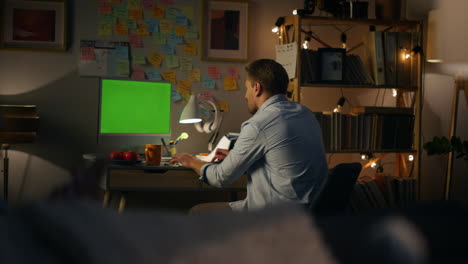 unknown man typing mockup computer closeup. freelancer making notes working