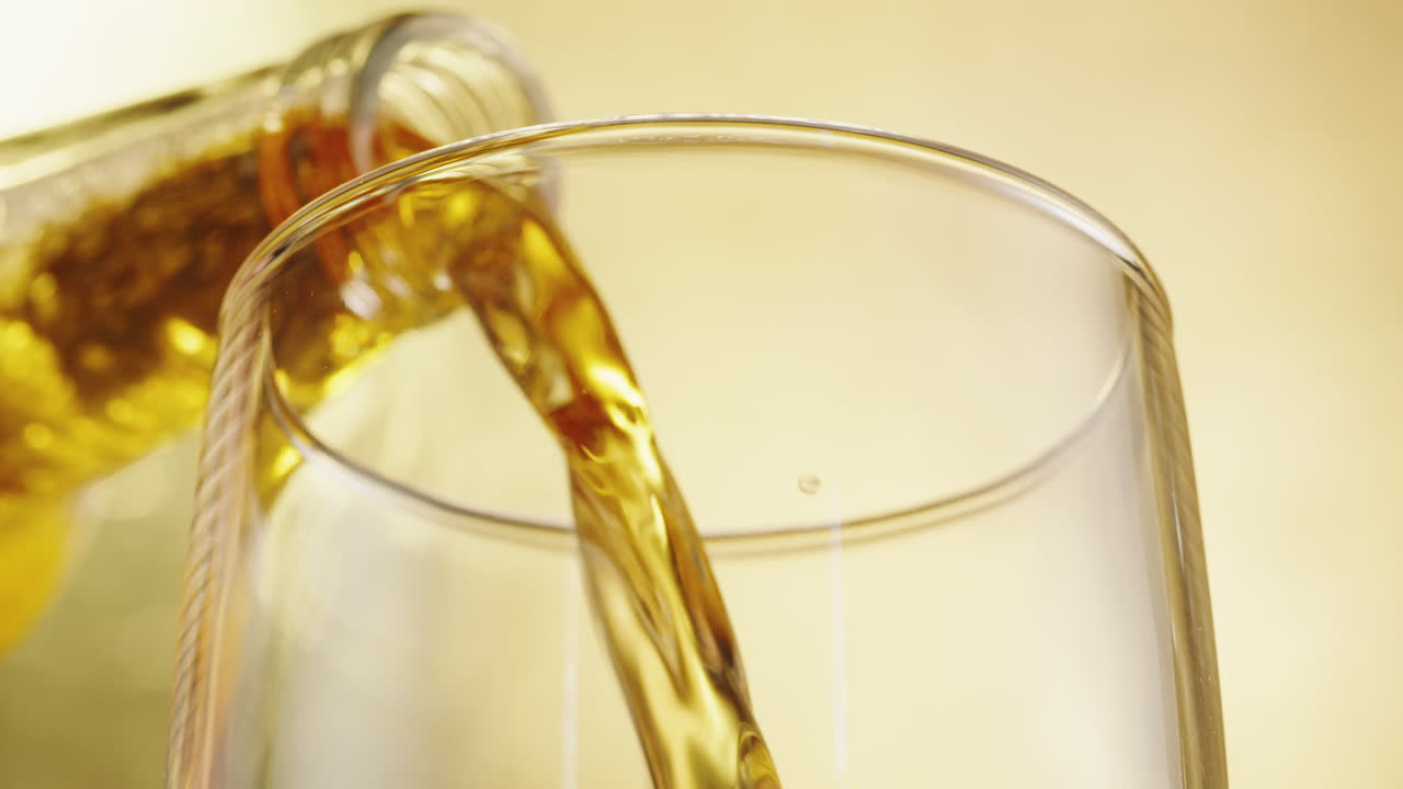 Beer Pouring Into Glass
