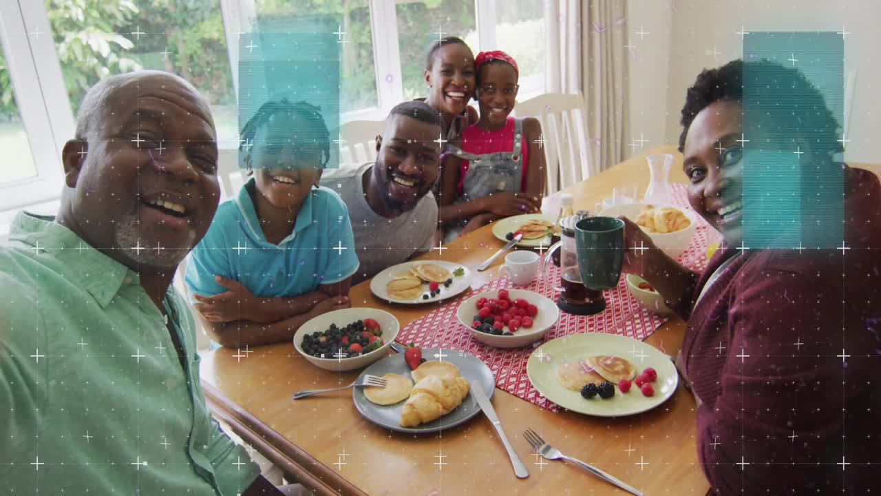 Elder man holding phone starting family posing at table glitches shifting then fading for marketing