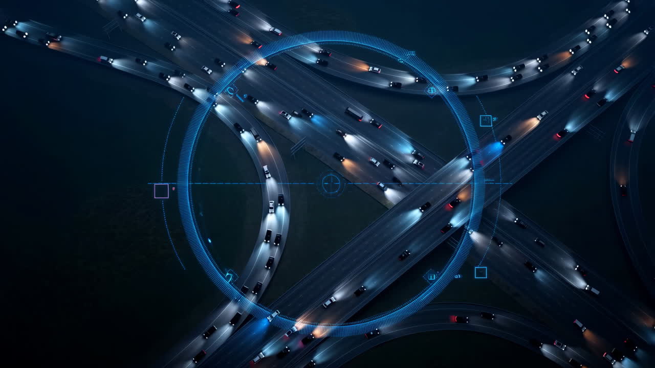 Aerial View of Busy Highway Interchange at Night with Futuristic Digital Overlay