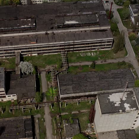 big abandoned territory of an old factory. ruined buildings of old industrial plant. aerial view