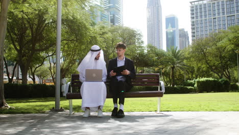 Men-sitting-on-the-bench-of-a-park