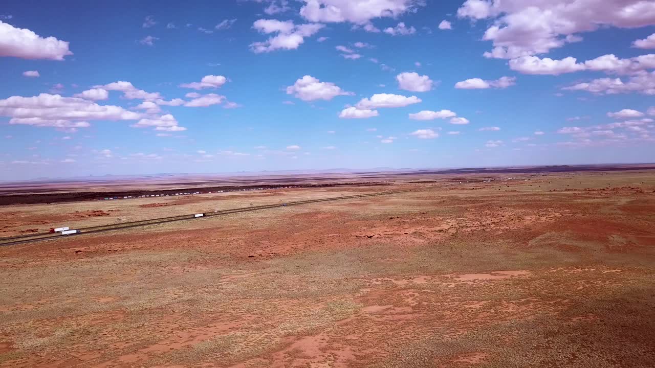 Drone over the Arizona desert near Winslow with the i40 in the background.