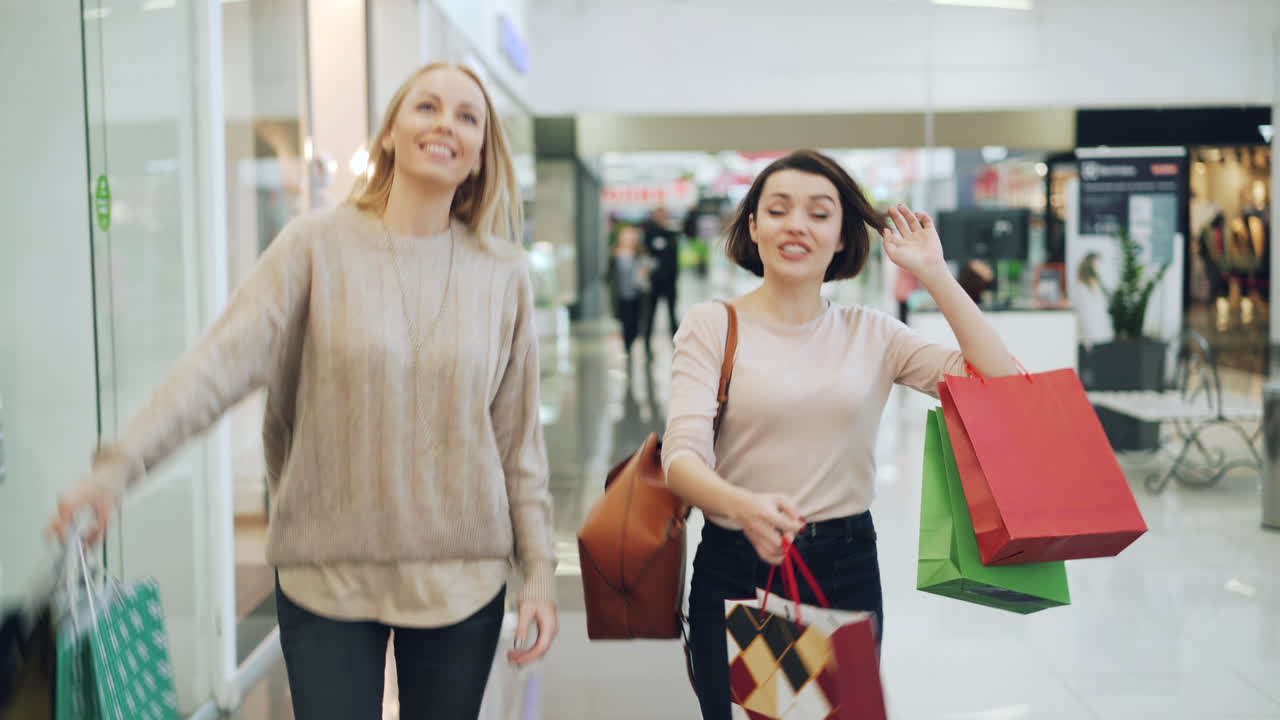 Happy Women Shopping at Mall