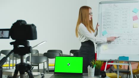 young female english teacher video conference calling on computer, talk by video camera learn teach in online chat. remote education, social distancing, quarantine prevention. green screen chroma key laptop for learning.