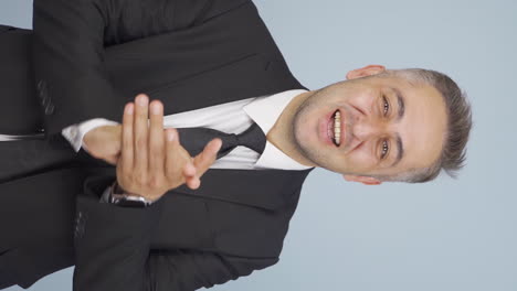 vertical video of businessman applauding.