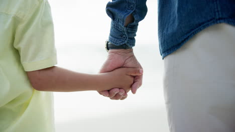 grandfather and grandson holding hands