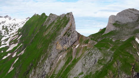 jagged peak at steep cliffs of schafler ridge viewpoint in the early morning in switzerland