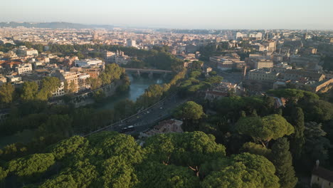 Aerial-flyover-establishes-Orange-Garden-Rome-Italy-at-sunset,-calm-peaceful-city