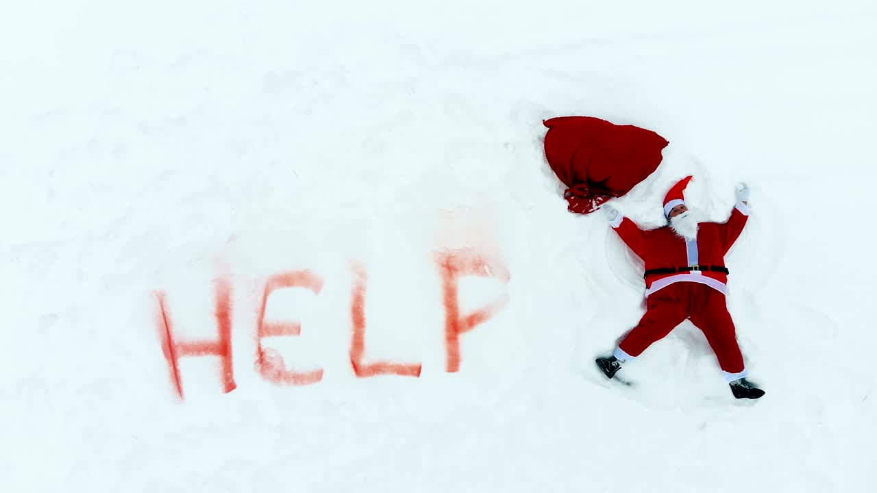 눈, '보조' 표지판과 산타클로스가 눈 천사를 만들고