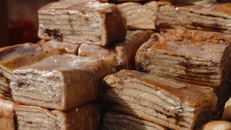 stacked traditional portuguese layered sweets in cellophane