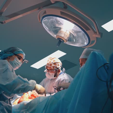 professional doctors of plastic surgery in the operating room. abdominoplasty of the abdomen. body correction