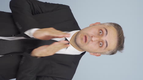 Vertical-video-of-Businessman-with-sore-eyes.