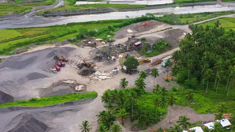 excavators and loaders working at gravel pit near the river