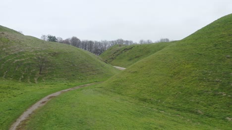 aerial: flying in between mounds in kernave medieval capital of the grand duchy of lithuania