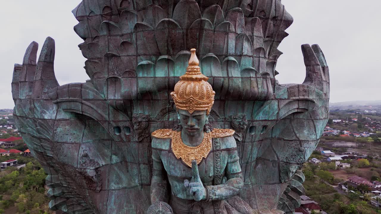 Aerial footage shows the Garuda Wisnu Kencana monument towering above southern Bali, crafted with intricate detail and standing as a symbol of Balinese spirituality and national pride