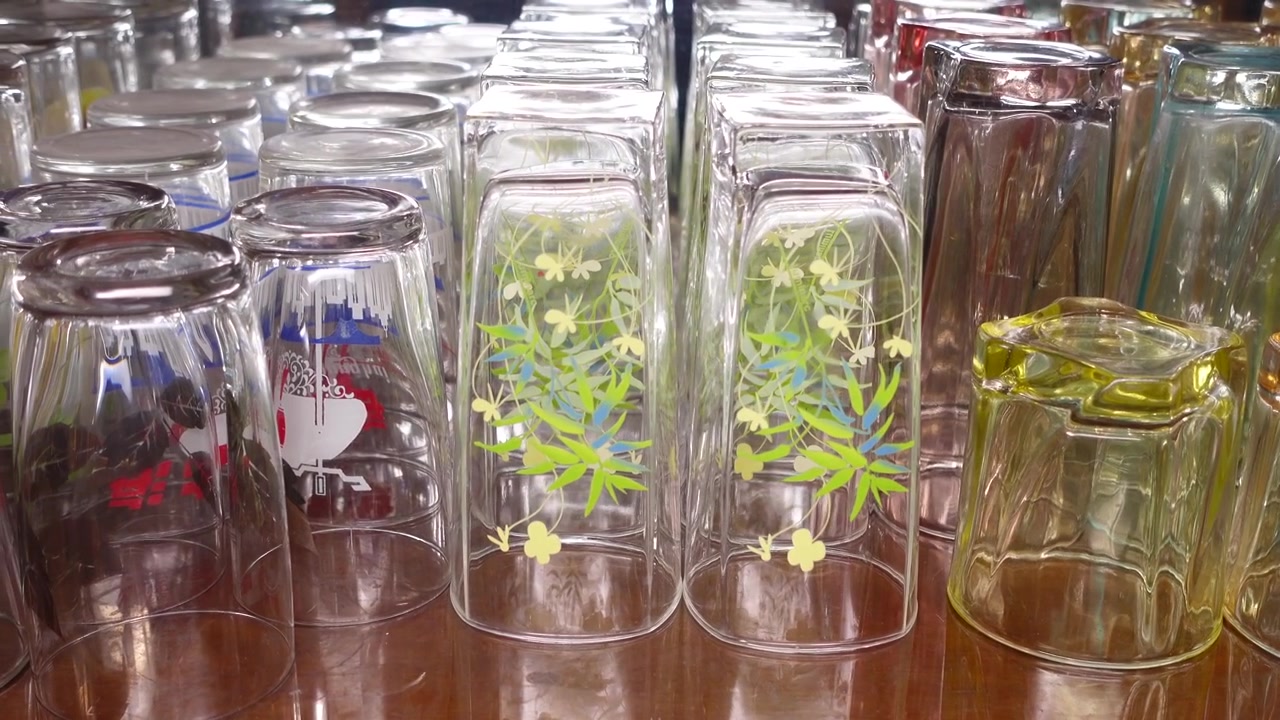 Rows of Inverted Drinking Glasses Arranged on a Table