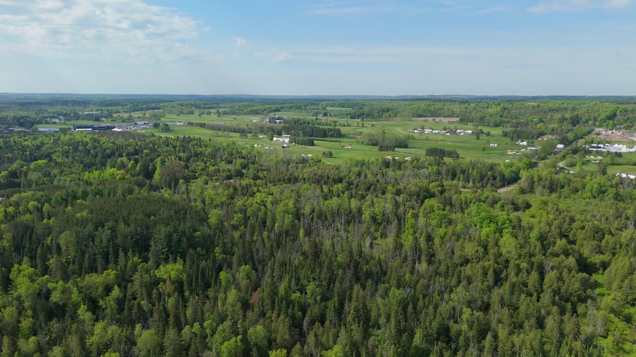 Aerial: TPC Toronto at Osprey Valley Golf Course during the day in Alton, Caledon, Ontario, Canada, establishing drone shot