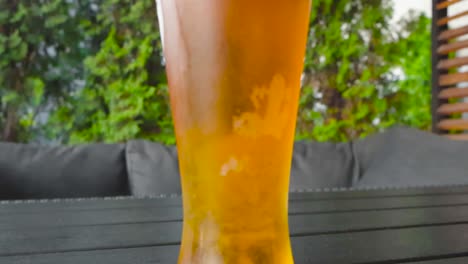 refreshing glass of beer on a sunny patio